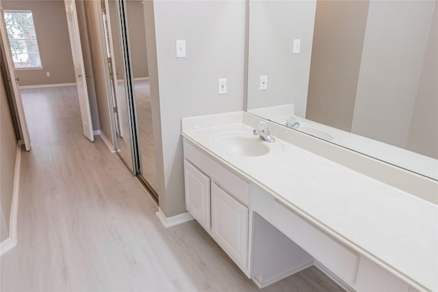 bathroom featuring vanity and hardwood / wood-style flooring