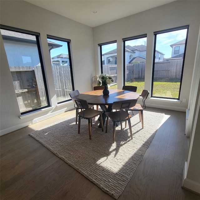 dining area featuring dark hardwood / wood-style floors