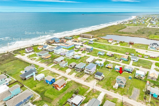 drone / aerial view featuring a residential view and a water view