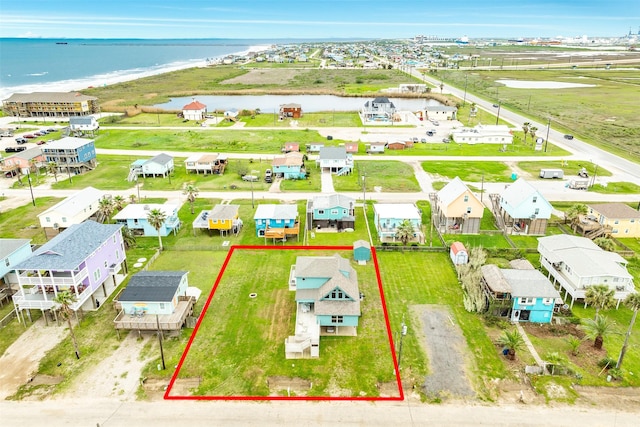 bird's eye view with a water view and a residential view