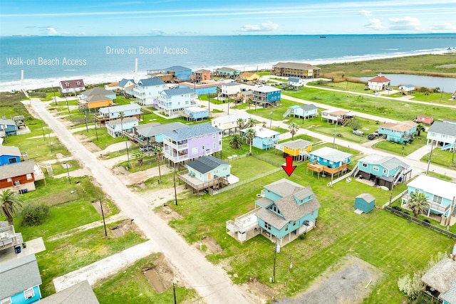 birds eye view of property with a residential view and a water view