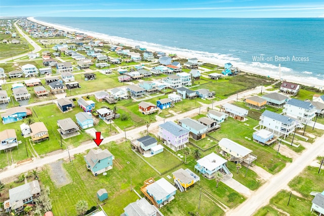 drone / aerial view featuring a water view and a residential view