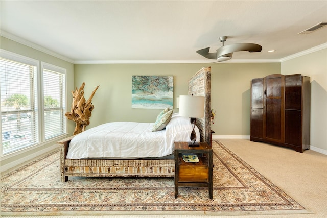 bedroom featuring carpet floors, ceiling fan, and ornamental molding