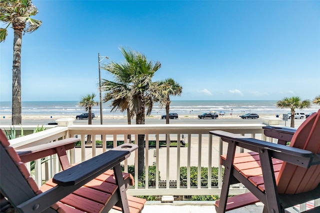 wooden terrace with a beach view and a water view