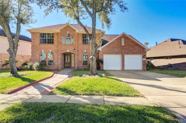 view of front facade featuring a front yard and a garage