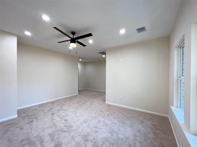 carpeted empty room with ceiling fan