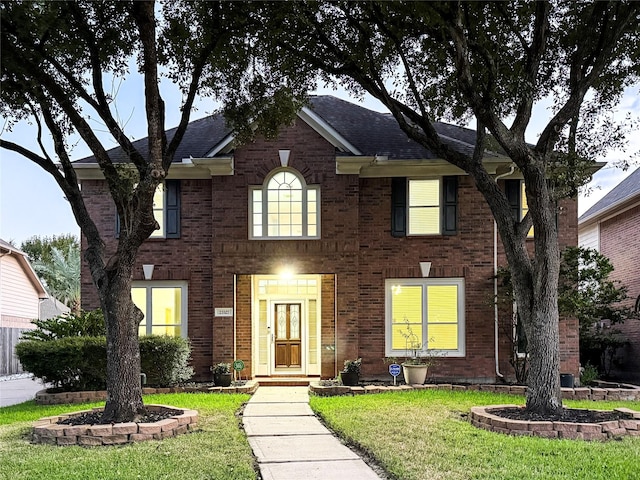 view of front of house with a front lawn