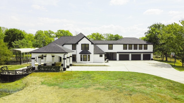 view of front facade with a front yard and a garage