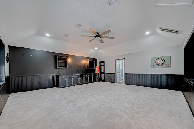 unfurnished room featuring ceiling fan and vaulted ceiling