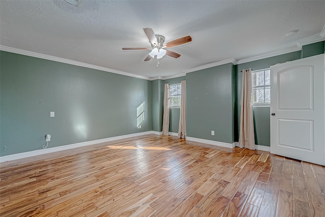 unfurnished room featuring a textured ceiling, ornamental molding, light hardwood / wood-style floors, and ceiling fan