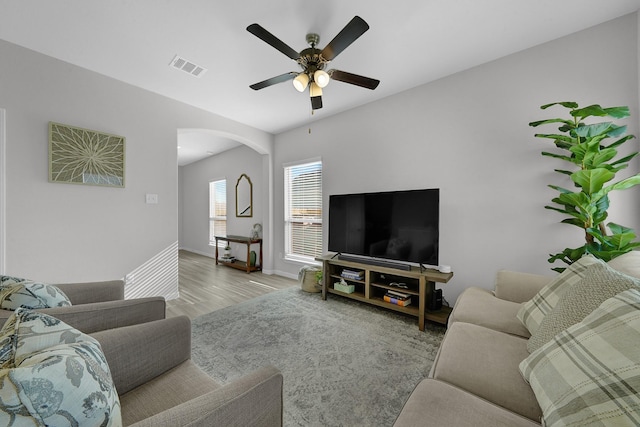 living room featuring ceiling fan and light hardwood / wood-style flooring