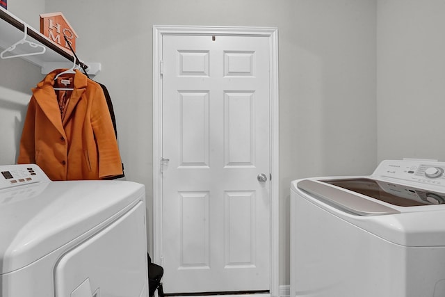 laundry room featuring washer and clothes dryer