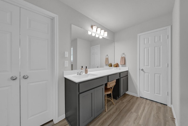 bathroom with vanity and hardwood / wood-style floors