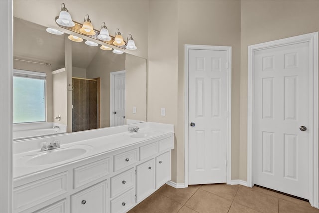 bathroom with plus walk in shower, tile patterned floors, and vanity