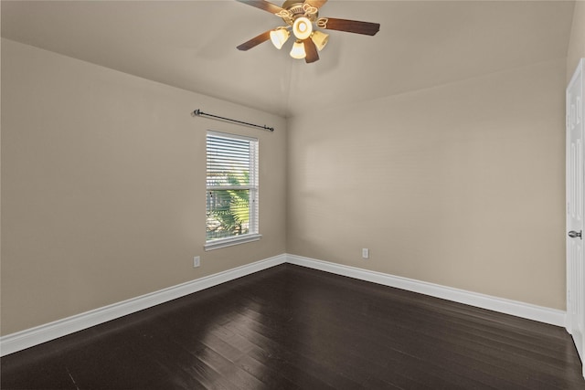 empty room featuring ceiling fan and dark hardwood / wood-style floors