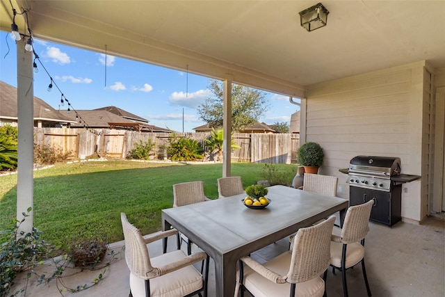 view of patio featuring a grill