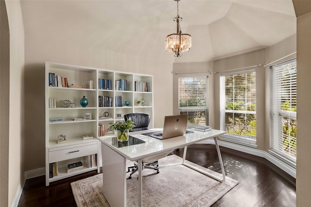 office featuring lofted ceiling, dark wood-type flooring, and a notable chandelier