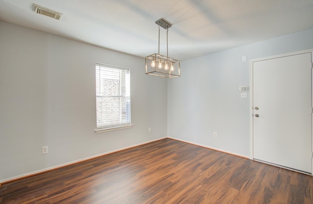 empty room with dark wood-type flooring