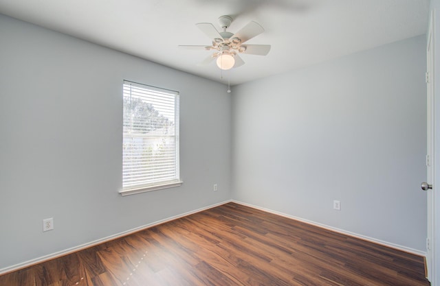 unfurnished room with ceiling fan and dark hardwood / wood-style floors