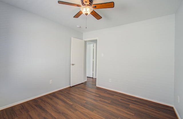 unfurnished room featuring ceiling fan and dark hardwood / wood-style floors