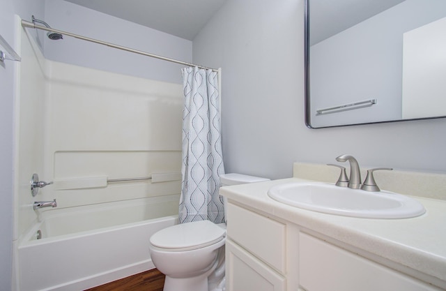 full bathroom featuring toilet, vanity, shower / bath combo with shower curtain, and hardwood / wood-style floors