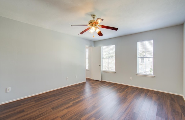 unfurnished room featuring ceiling fan and dark hardwood / wood-style floors