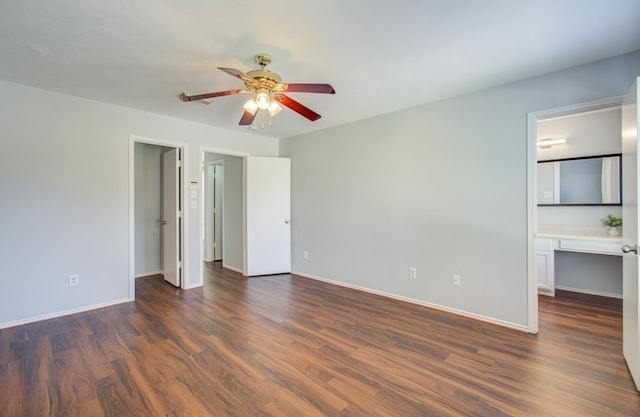 unfurnished bedroom featuring ceiling fan, dark hardwood / wood-style flooring, and connected bathroom