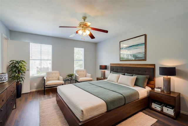 bedroom featuring ceiling fan and dark wood-type flooring