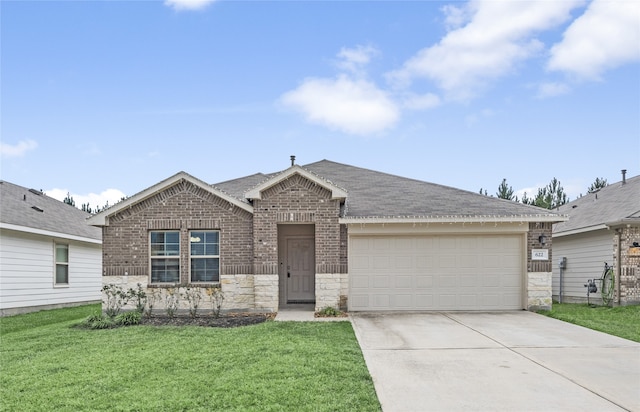 view of front facade with a front yard and a garage