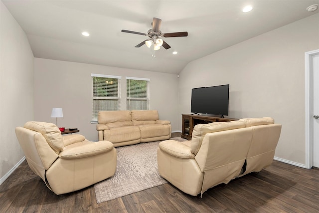 living room with ceiling fan, vaulted ceiling, and dark hardwood / wood-style floors