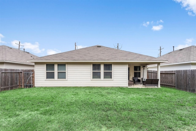 back of house featuring a yard and a patio