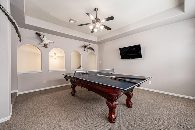 game room featuring baseboards, visible vents, a tray ceiling, and carpet flooring