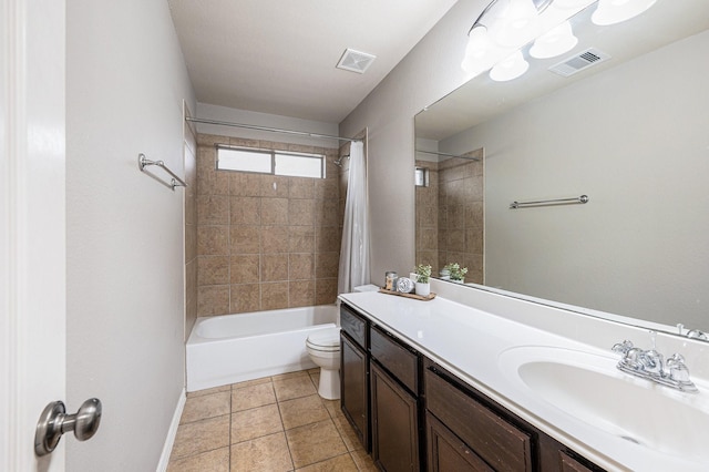 bathroom with toilet, visible vents, vanity, tile patterned floors, and shower / bath combo with shower curtain