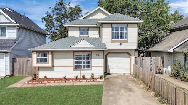 view of front of house with a front lawn and a garage