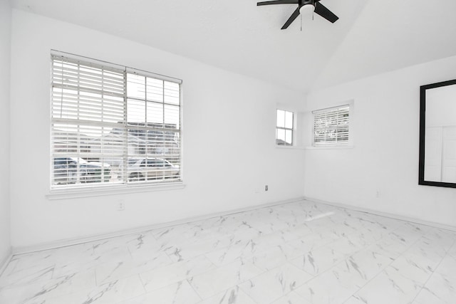 unfurnished room with ceiling fan and vaulted ceiling