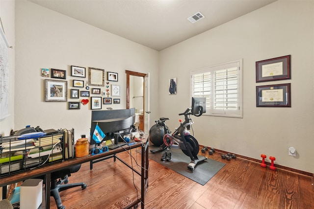 workout room featuring wood-type flooring