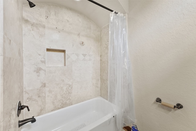 bathroom with shower / bathtub combination with curtain