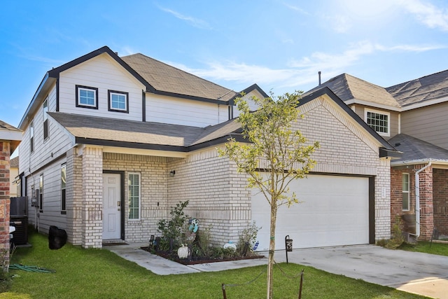 view of front of house featuring a garage and a front lawn