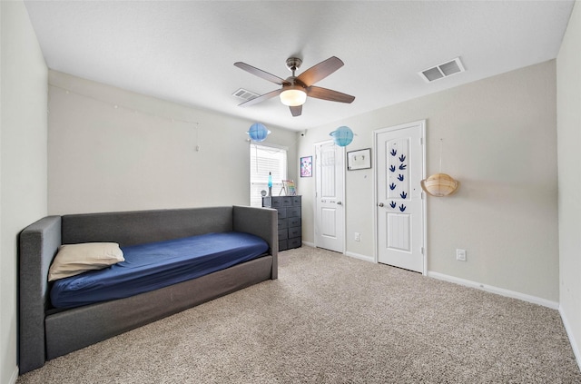 sitting room featuring ceiling fan and carpet flooring