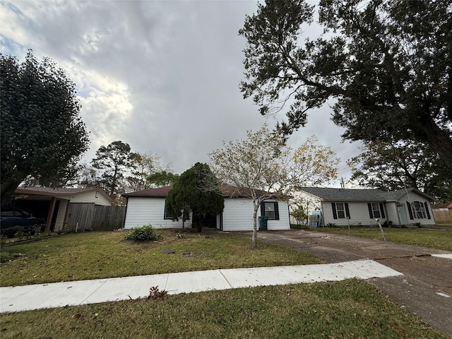 ranch-style house with a front lawn