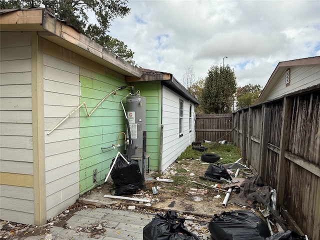 view of home's exterior featuring water heater