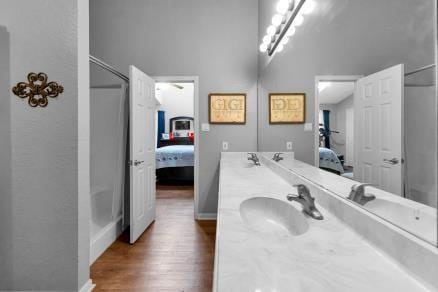 bathroom featuring vanity and hardwood / wood-style flooring