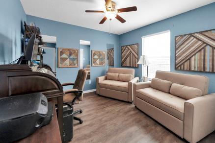 office space featuring ceiling fan and light hardwood / wood-style floors