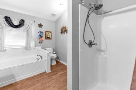 bathroom with wood-type flooring, independent shower and bath, and toilet