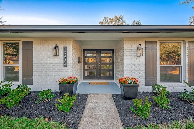 view of exterior entry featuring french doors