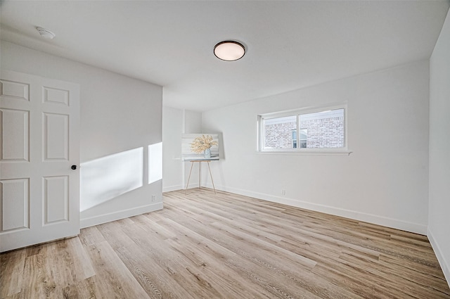 unfurnished room with light hardwood / wood-style flooring