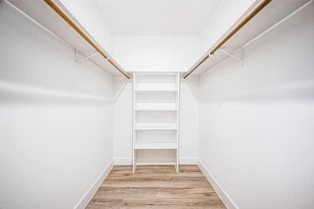 walk in closet featuring light hardwood / wood-style floors