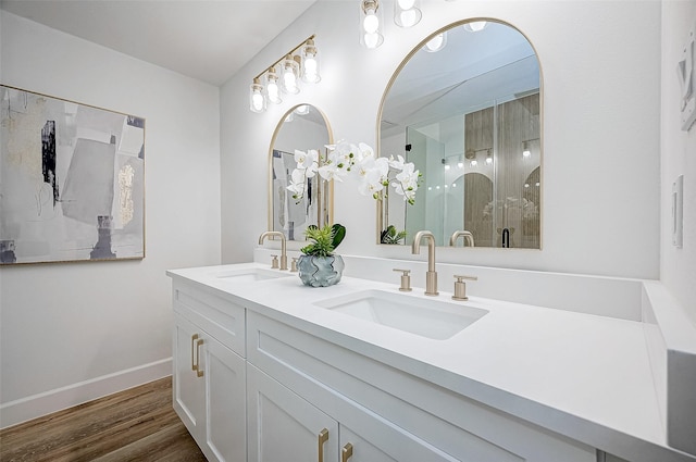 bathroom featuring vanity, a shower with shower door, and hardwood / wood-style flooring