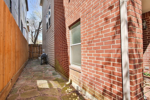 view of side of property featuring a patio area