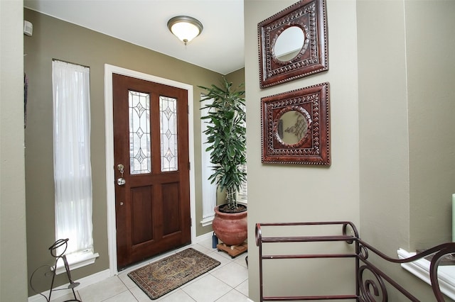 entryway with light tile patterned floors